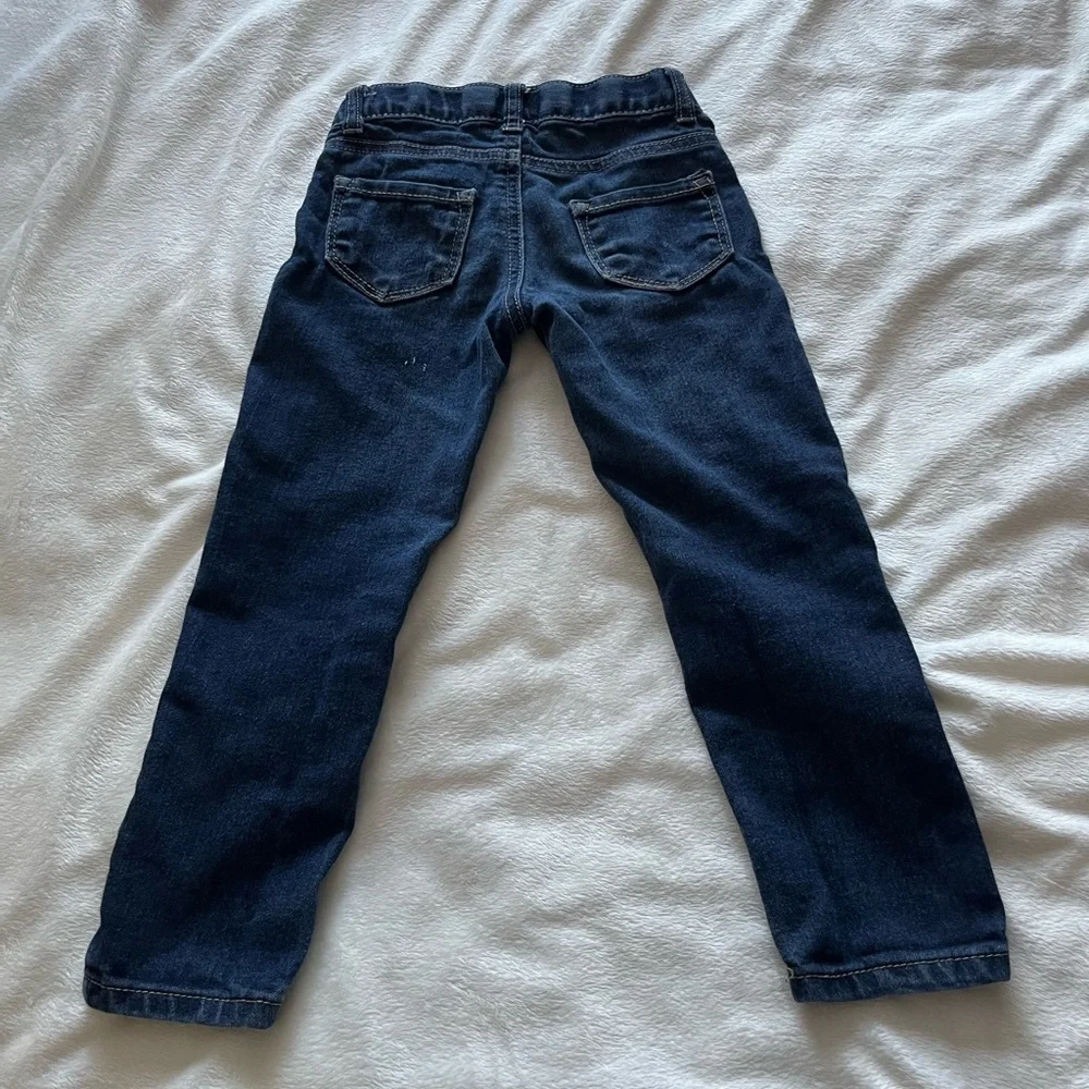 Cat & Jack kids blue jeans size 4T. Gold stitching around pockets.